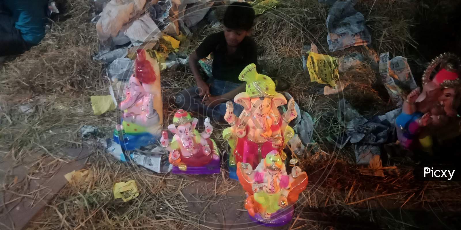 Lord Ganesha Statue With Colorful Painting Art.
