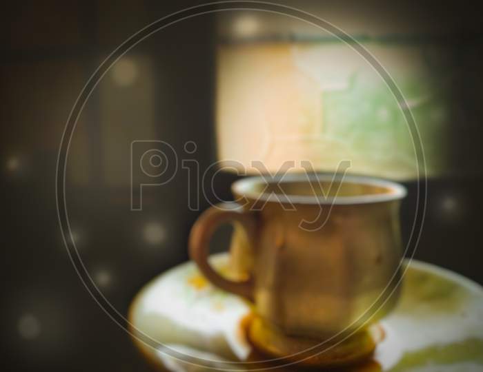 A tea of cup at morning, related blur.