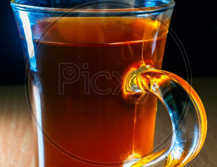 An Isolated View Of A Glass Of Black Tea