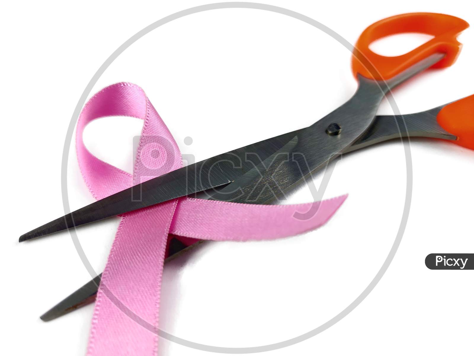 Pink ribbon with Scissors , fight with breast cancer Concept,  Selective Focus.