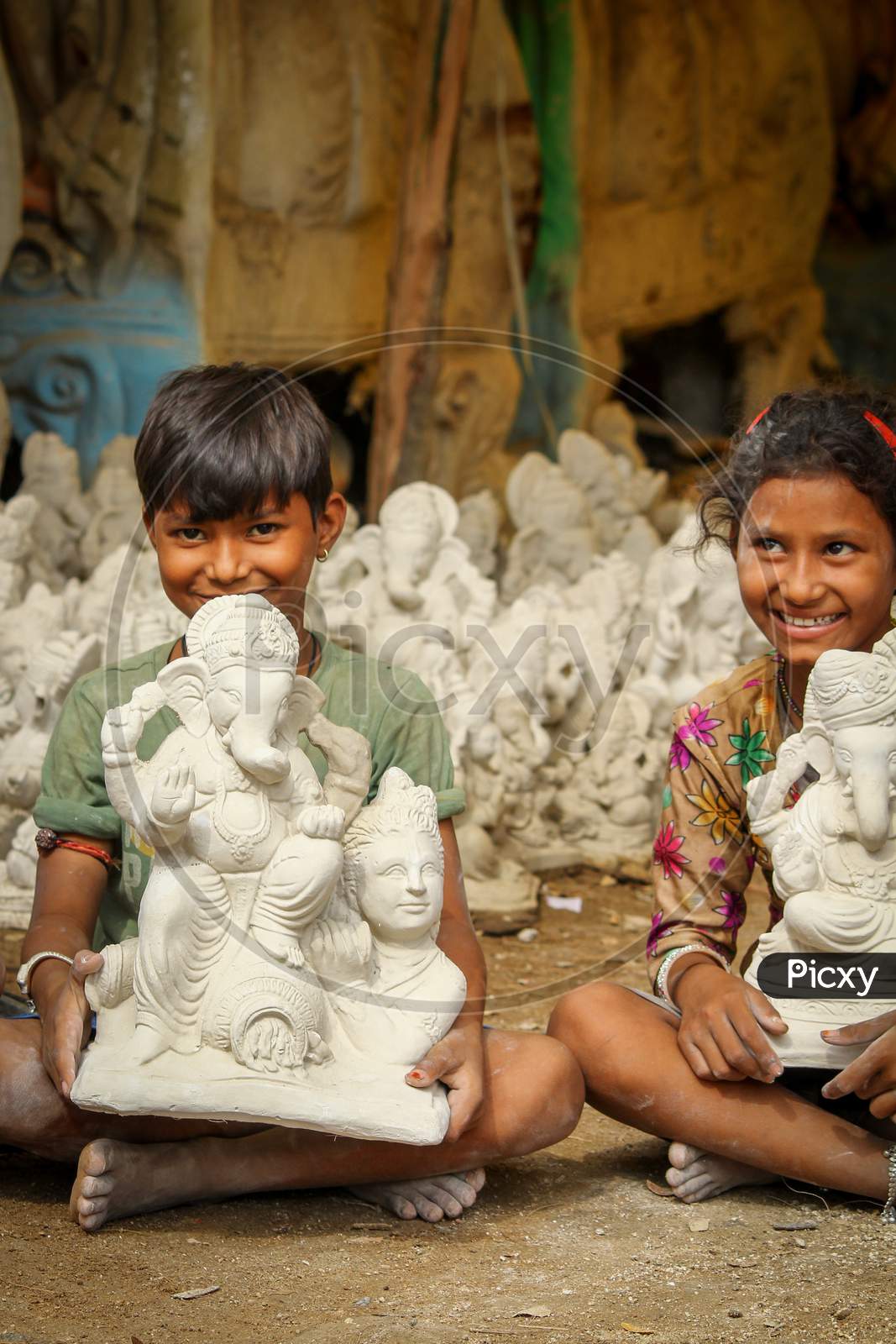 Kids show casing the Lord Ganesh idol