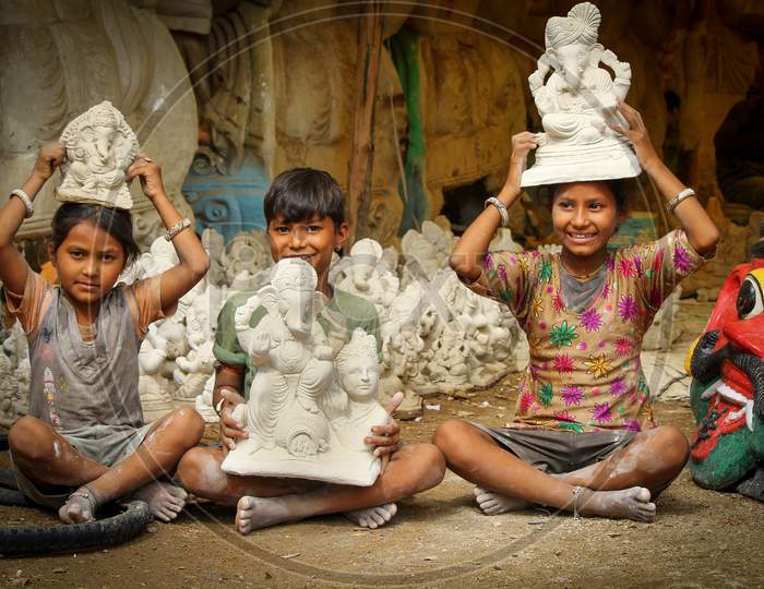 Kids showing the Lord Ganesh idol