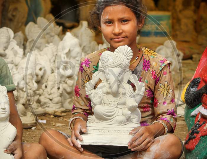 Kids showing the Lord Ganesh idol