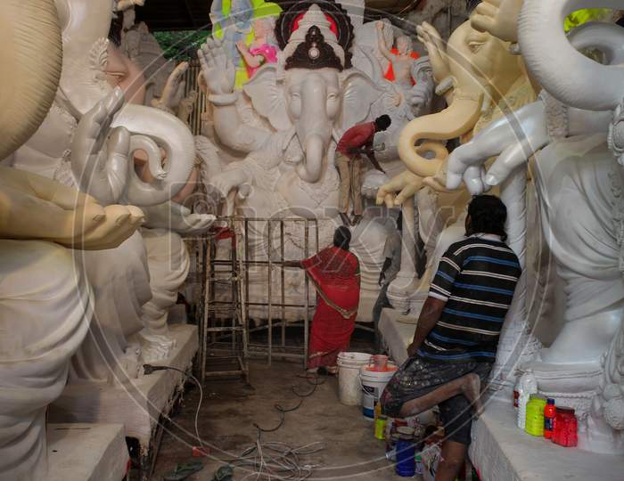 craftsmen busy in preparing ganesh idols for ganesh chaturthi