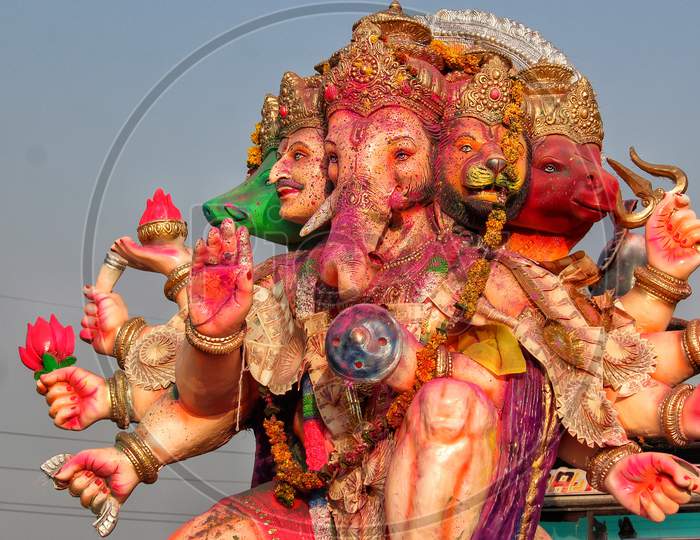 People Carrying Hindu God Idol Ganesh For Holy Immersion (Ganpati Visharjan) At The Ganges River