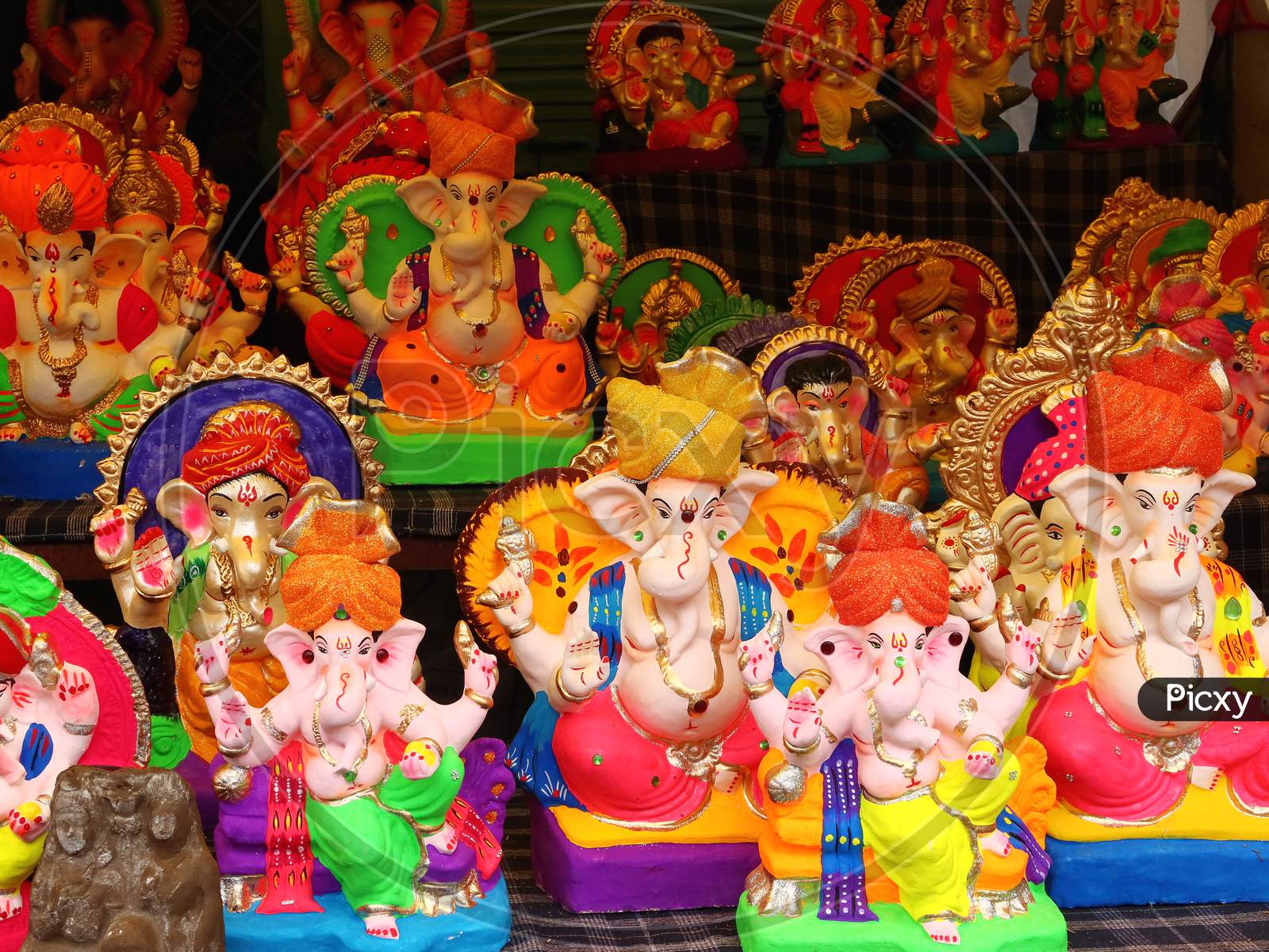 Lord Ganesha idol on sale at market during Ganesha Chaturthi festival.
