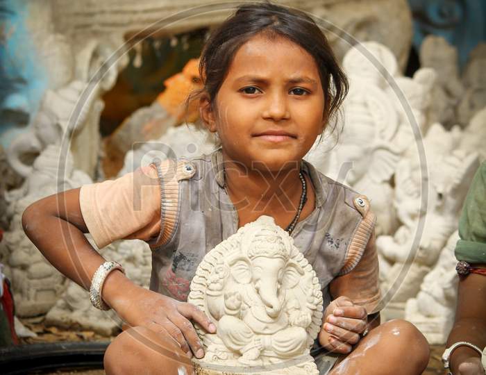Kids Showing the Lord Ganesh idol