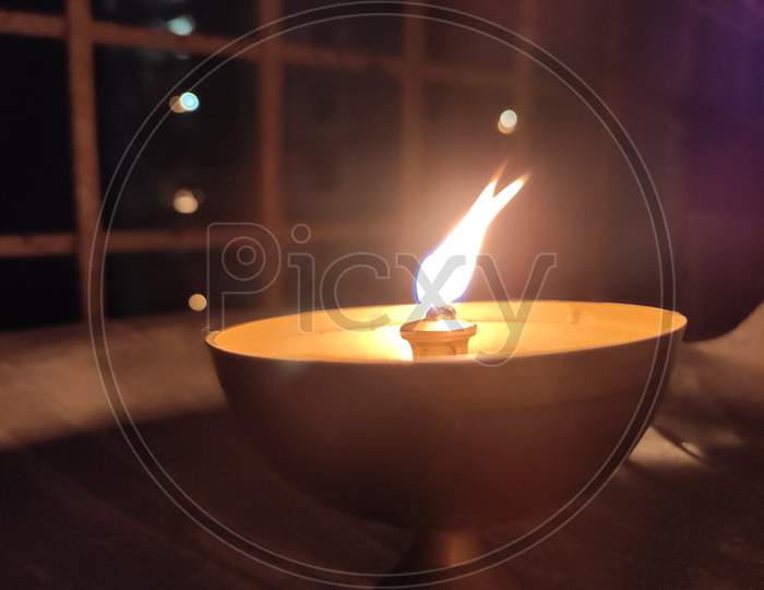 A Diya (Lamp) Placed In The Balcony.