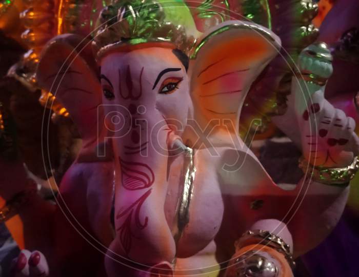 Lord Ganesha Statue With Colorful Painting Art.
