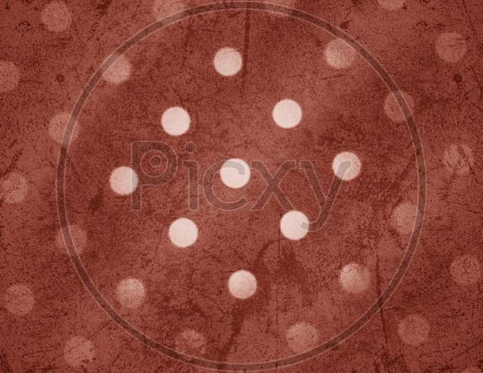 Warm sienna color dotted pattern on wavy background.