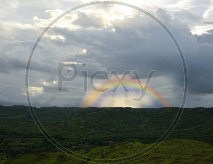 Landscape Nature Mountain In India With Rainbow.
