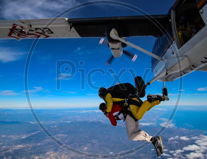 Man Enjoying Skydiving In The Sky.