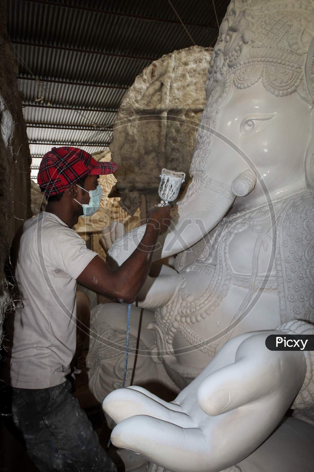 craftsmen busy in preparing ganesh idols for ganesh chaturthi