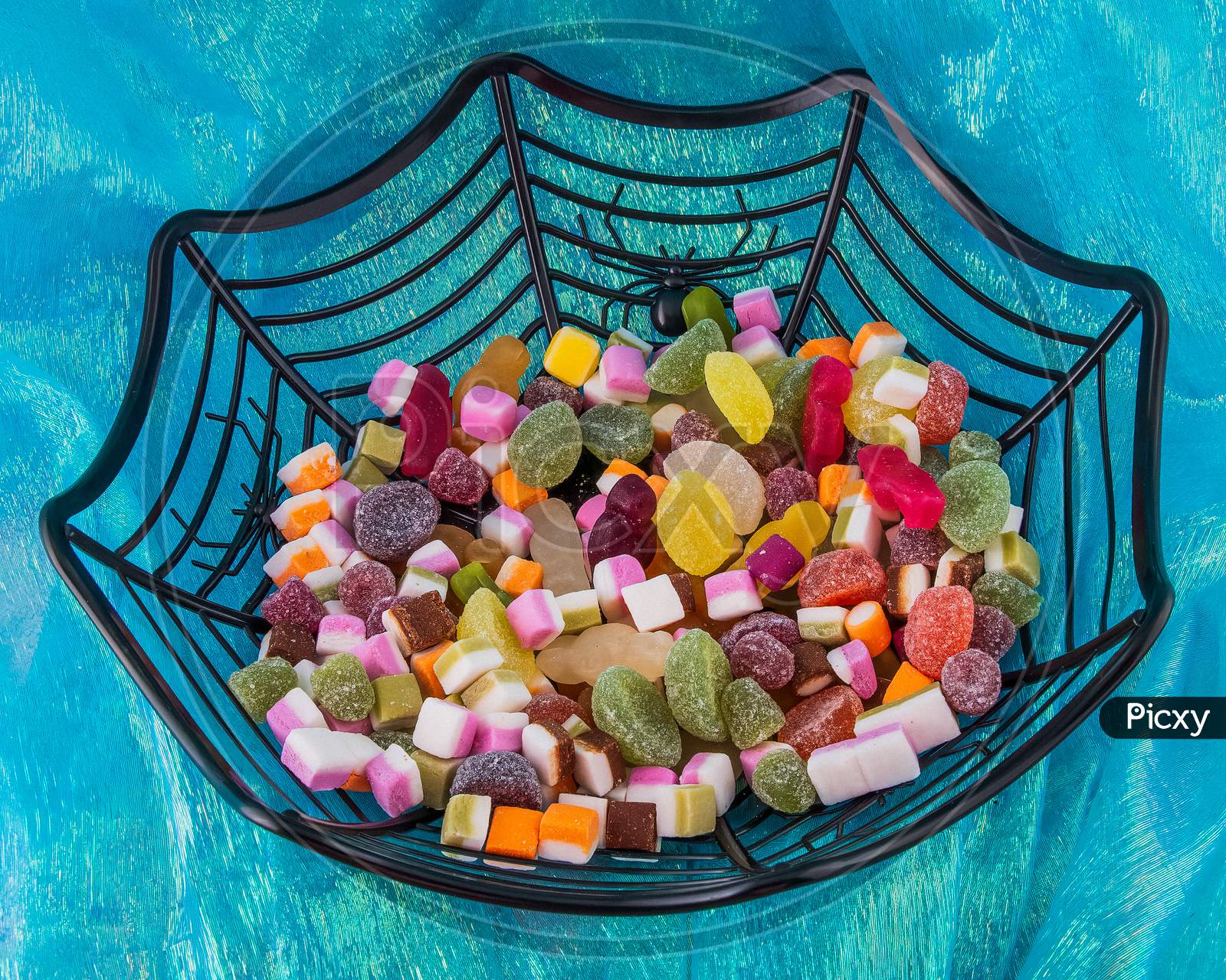 Halloween Trick Or Treat Spider Web Style Bowl With Candy Goodies On Blue