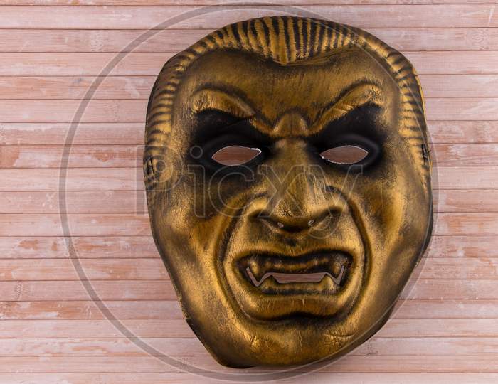 Gold Vampire Mask On Wooden Background