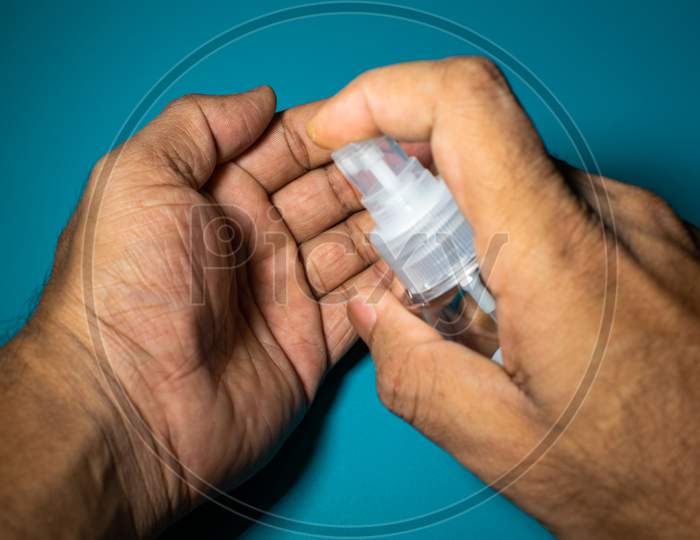 A Man Hand Cleaning Hand With Sanitizer To Prevent Corona Virus, Covid 19