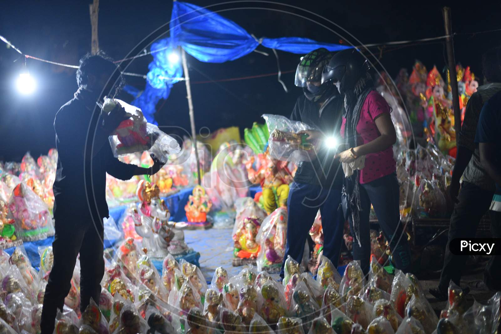 A vendor shows idols of hindu deity, Lord Ganesh ahead of Ganesh Chaturthi/ Vinayaka Chavithi festival in Hyderabad on August 21, 2020.