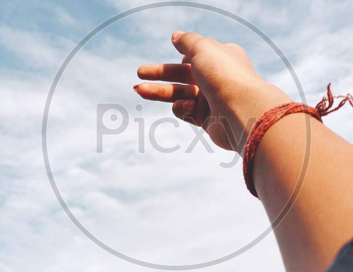 Human hand in sky