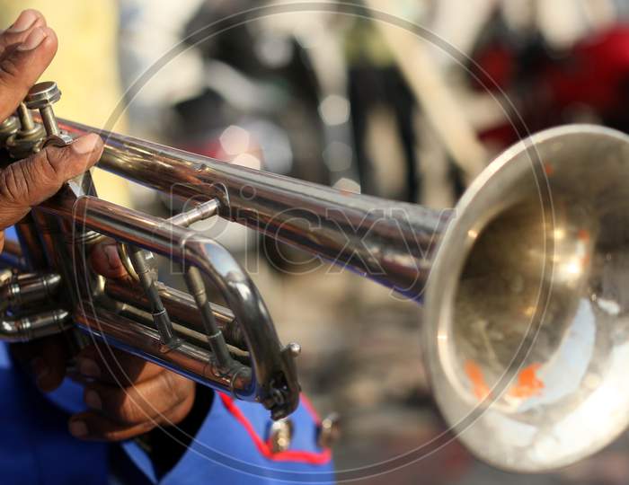Close-up view of Indian musician playing trumpet