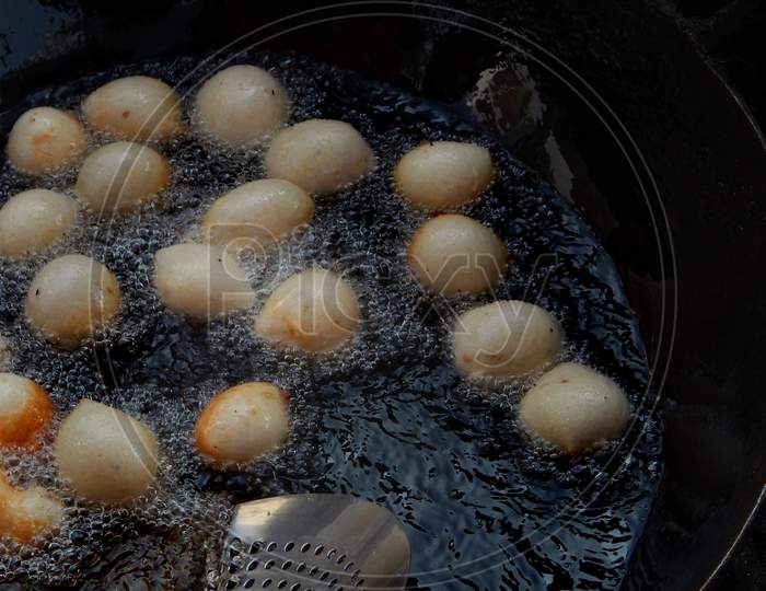 Close-up view of making of Indian street  food Mysore Bonda