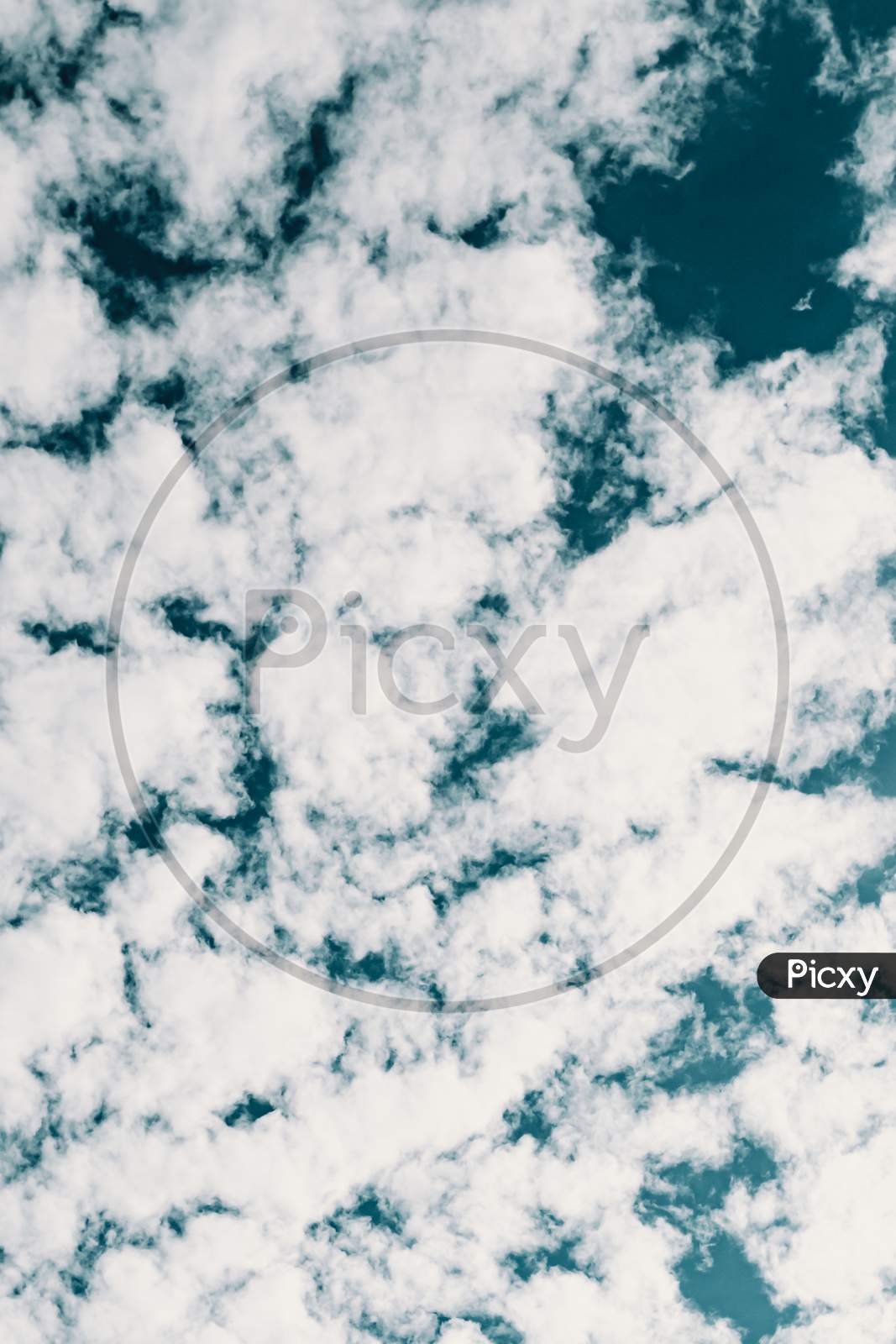 Background Made Of Clean White Clouds Over A Deep Blue Sky