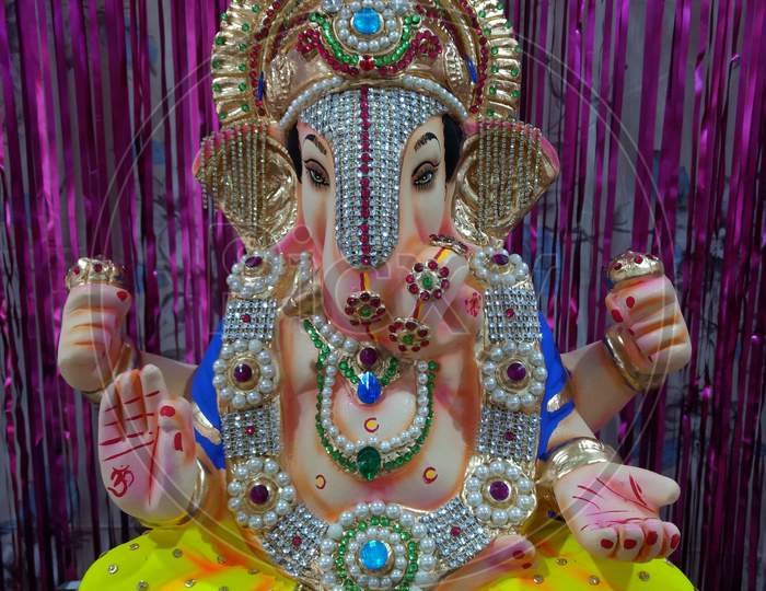 Ganpati bappa murti ( Ganesh idol) with colourful background, ganpati sthapana