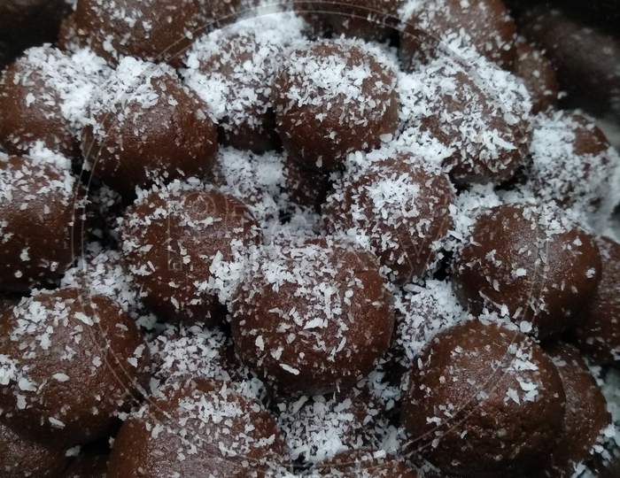 Chocolate balls with coconut powder