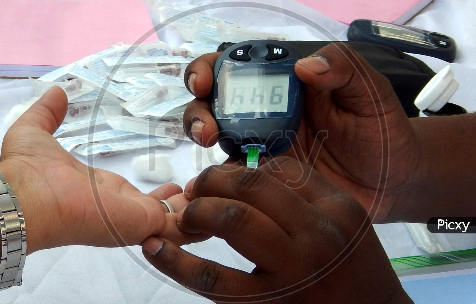 Close-up view of Indian Doctor checking Blood sugar level of a patient