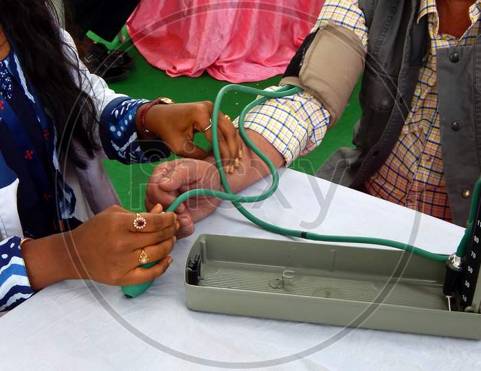 Close-up view of Indian Doctor checking Blood pressure of a patient