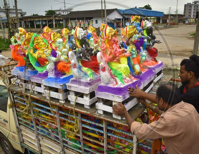Workers Load Ganesh Idols On A Transport Vehicle Ahead Of The Ganesh Chaturthi Festival At A Workshop, In Vijayawada On August 19, 2020.