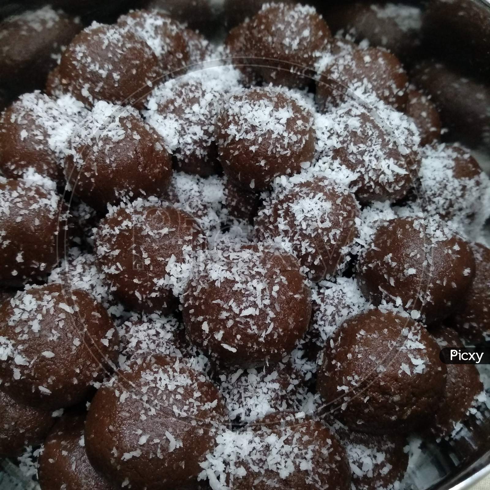 Chocolate balls with coconut powder