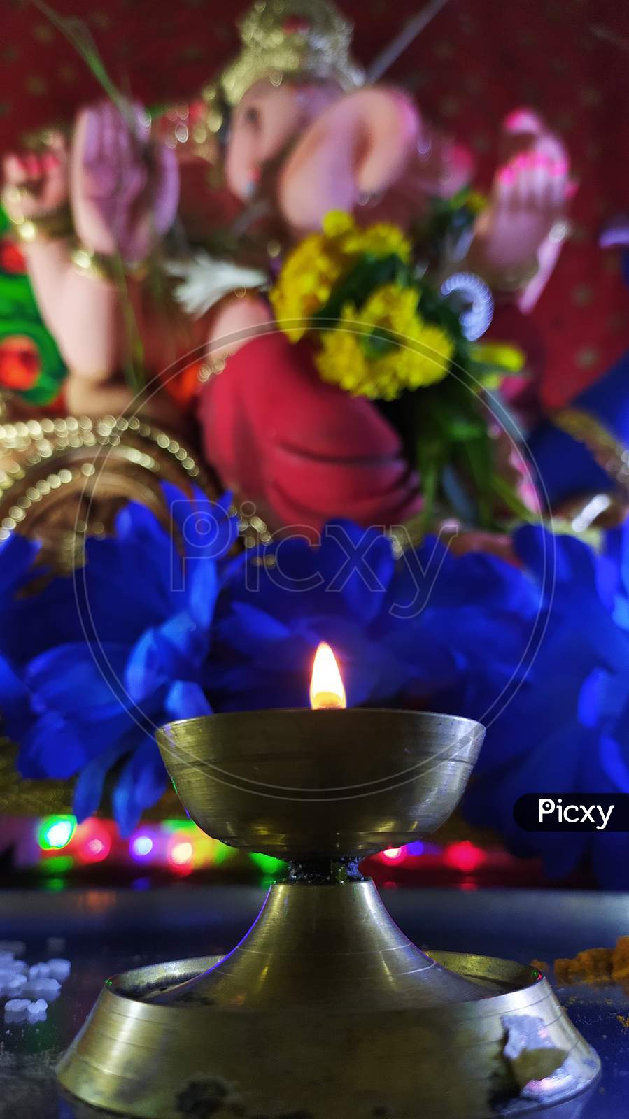 Ganesha Idol with Diya in focus
