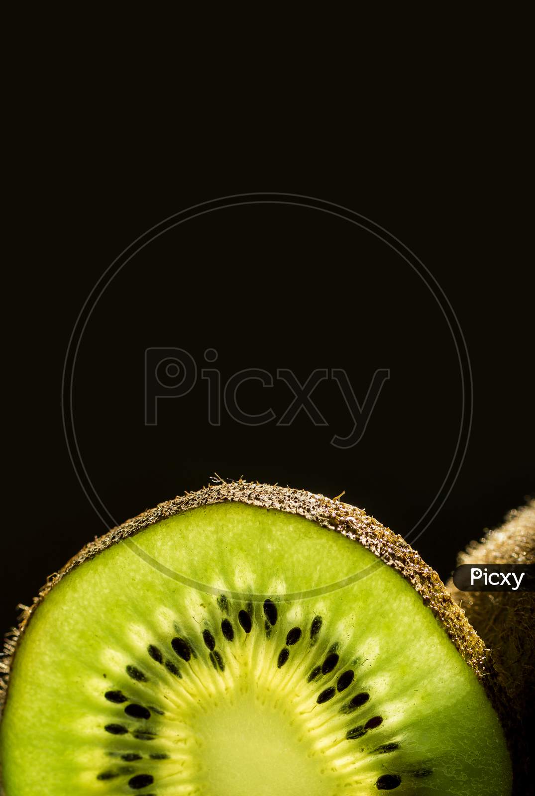 Kiwi Fruit On Black Background