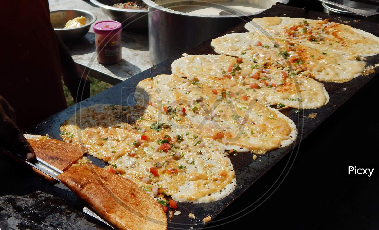 Close-up view of making of Indian street  food Masala Dosa