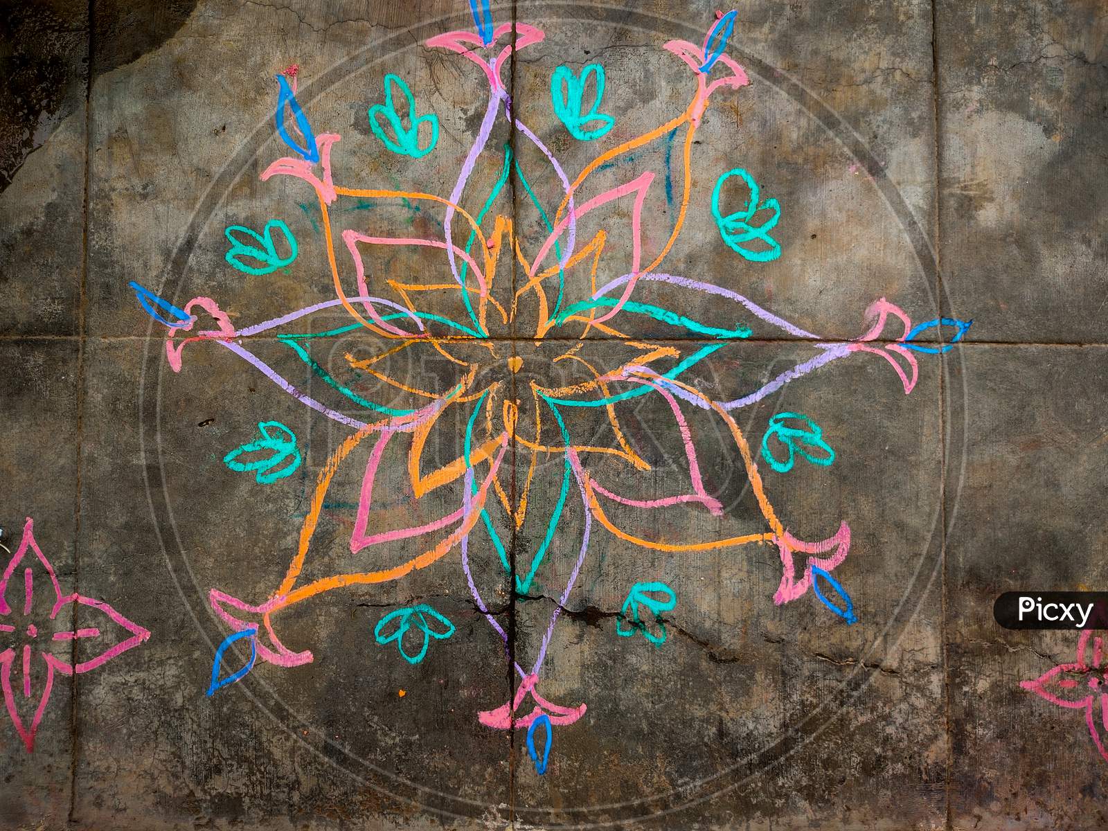 Colorful Flower Kolam Drawn Using Color Chalk Pieces. In Front Of South Indian Home. Festival Time Concept