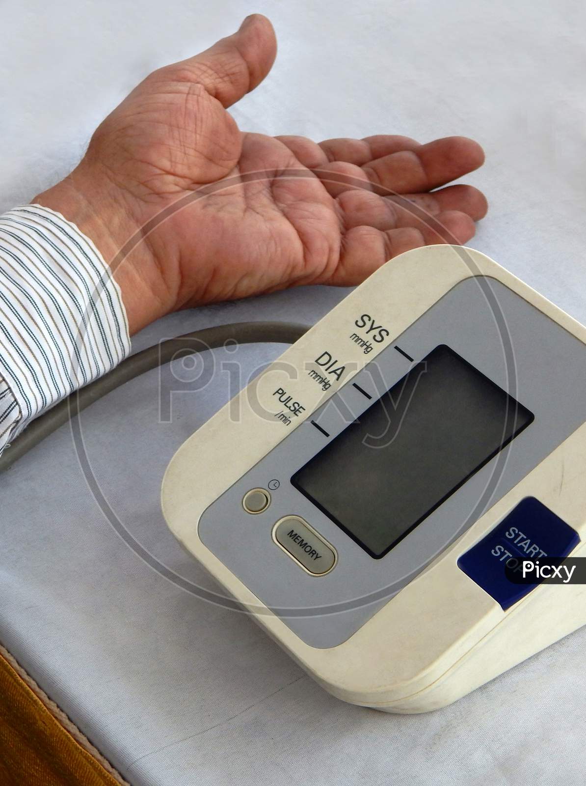 Close-up view of Indian man checking Blood pressure