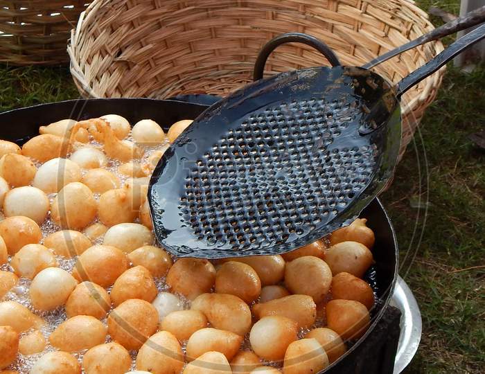 Close-up view of making of Indian street  food Mysore Bonda