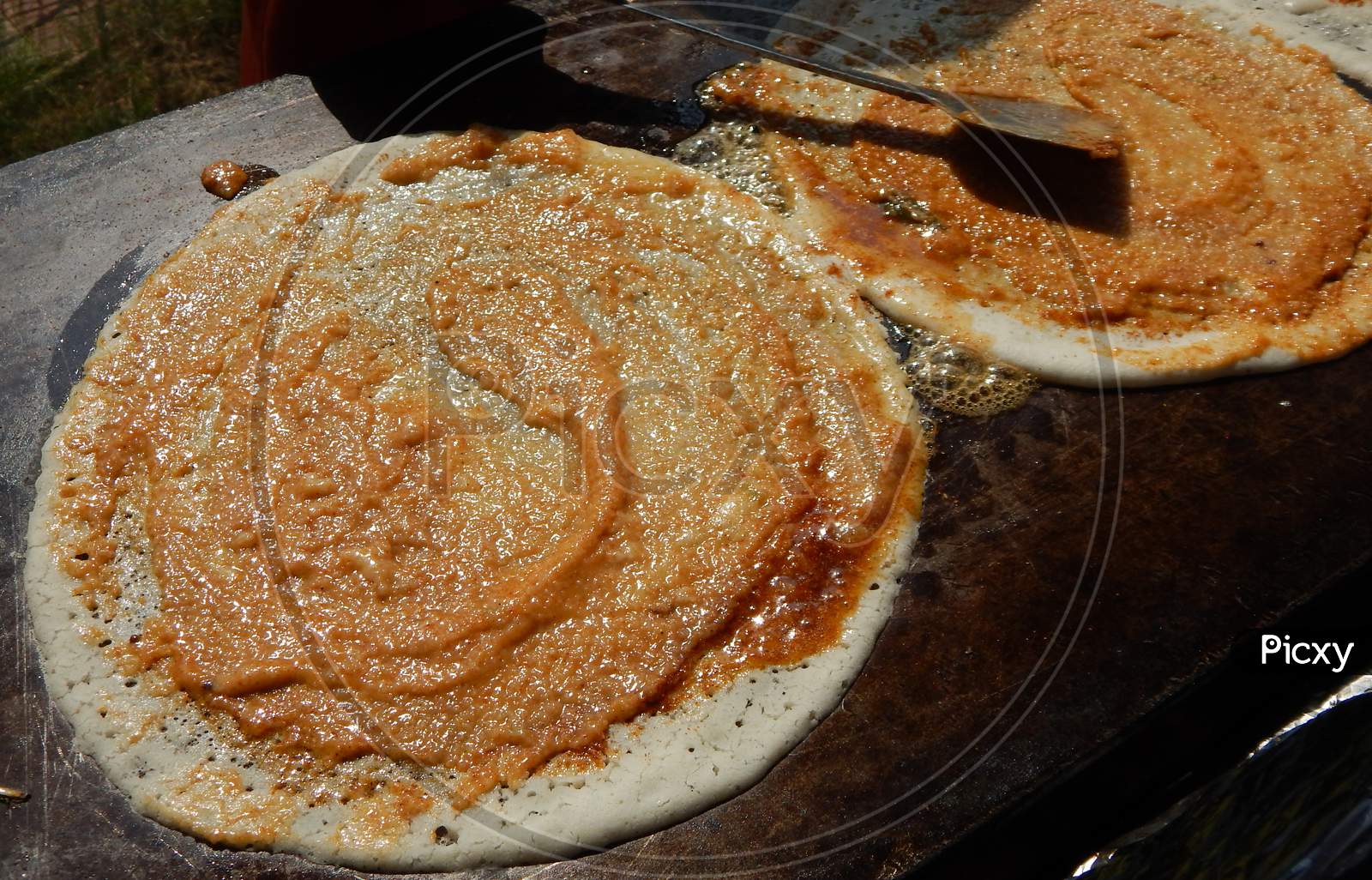 Close-up view of making Indian street  food Masala Dosa