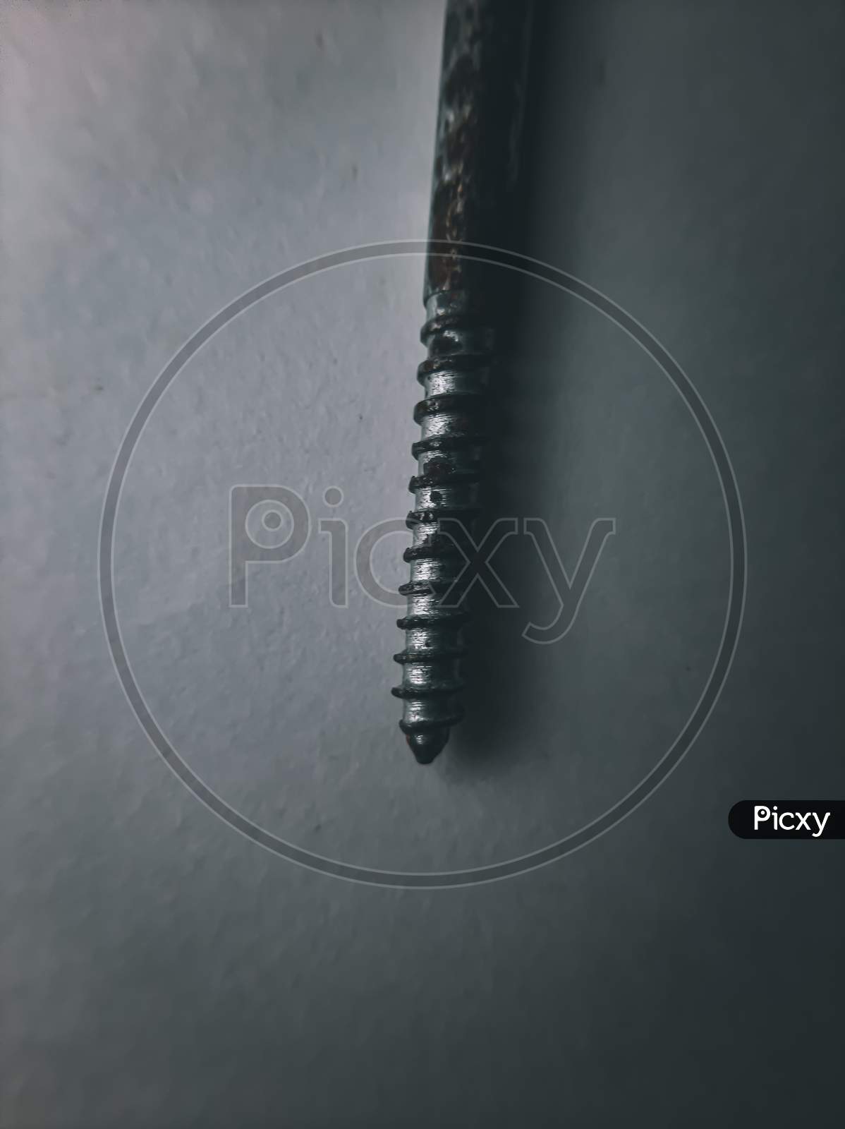 screw.Screw photo with some details and structure. Macro photography with mobile phone