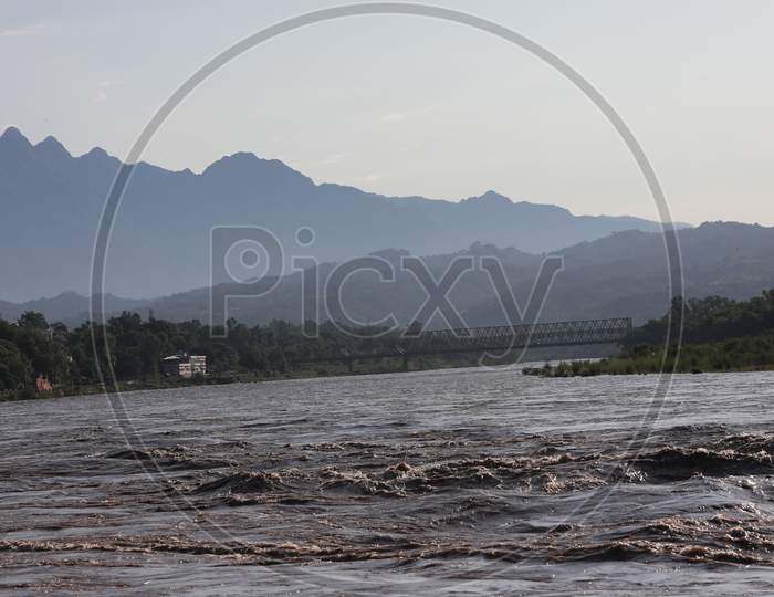 The river Chenab in full spate in Akhnoor area of Jammu on August 22, 2020 after authorities opened Salal Dam reservoir gates following heavy rains over the past two days in Jammu and Kashmir.