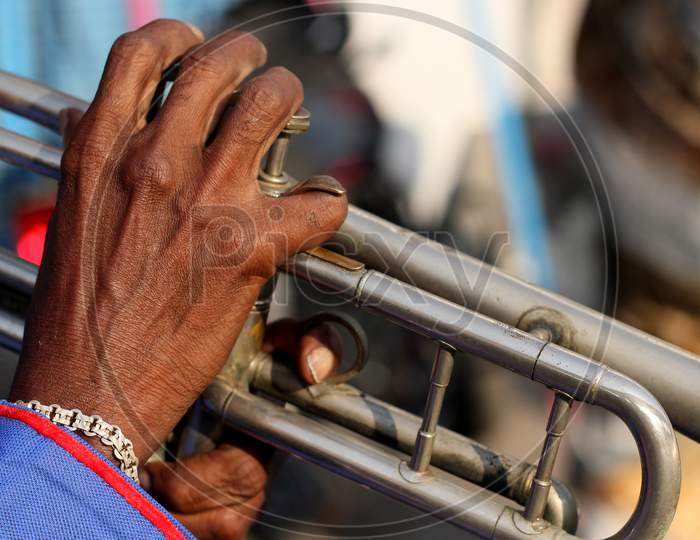 Close-up view of Indian musician playing trumpet