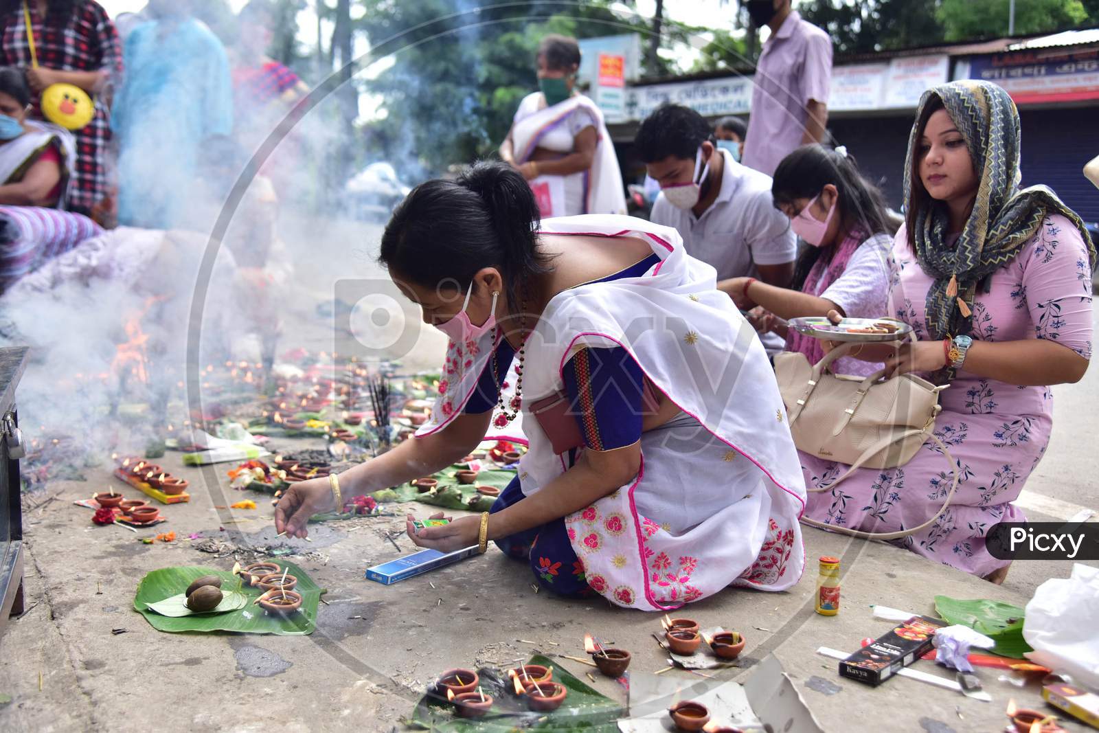 Devotees Lighting The Earthen Lamp To Offer Prayers To Lord Ganesha On The Occasion Of  Ganesh Chaturthi Festival In Nagaon District Of Assam On August 22,2020.