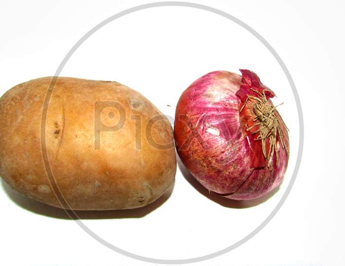 Onion and potato on white background