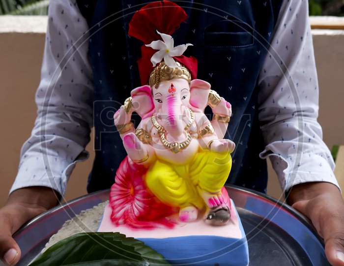 Closeup Shot Of Colorful Idol Ganesha Bringing To Home