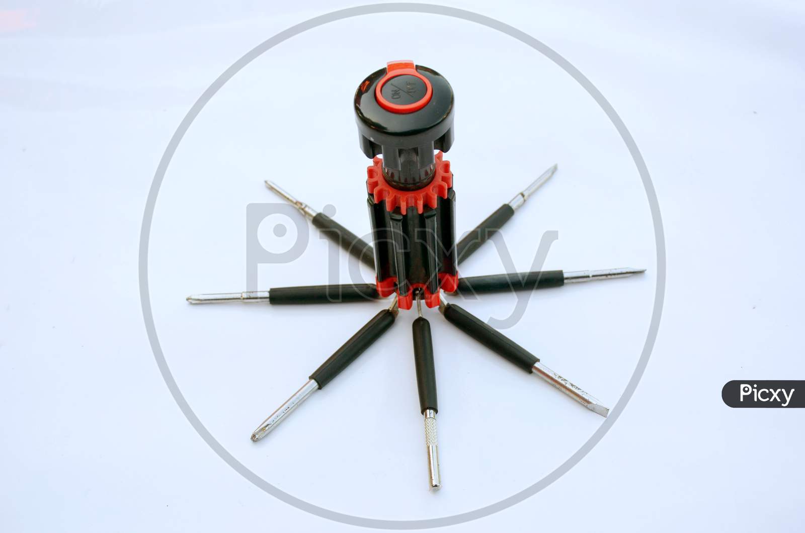 The Old Black Red Screw Driver Isolated On White Background.