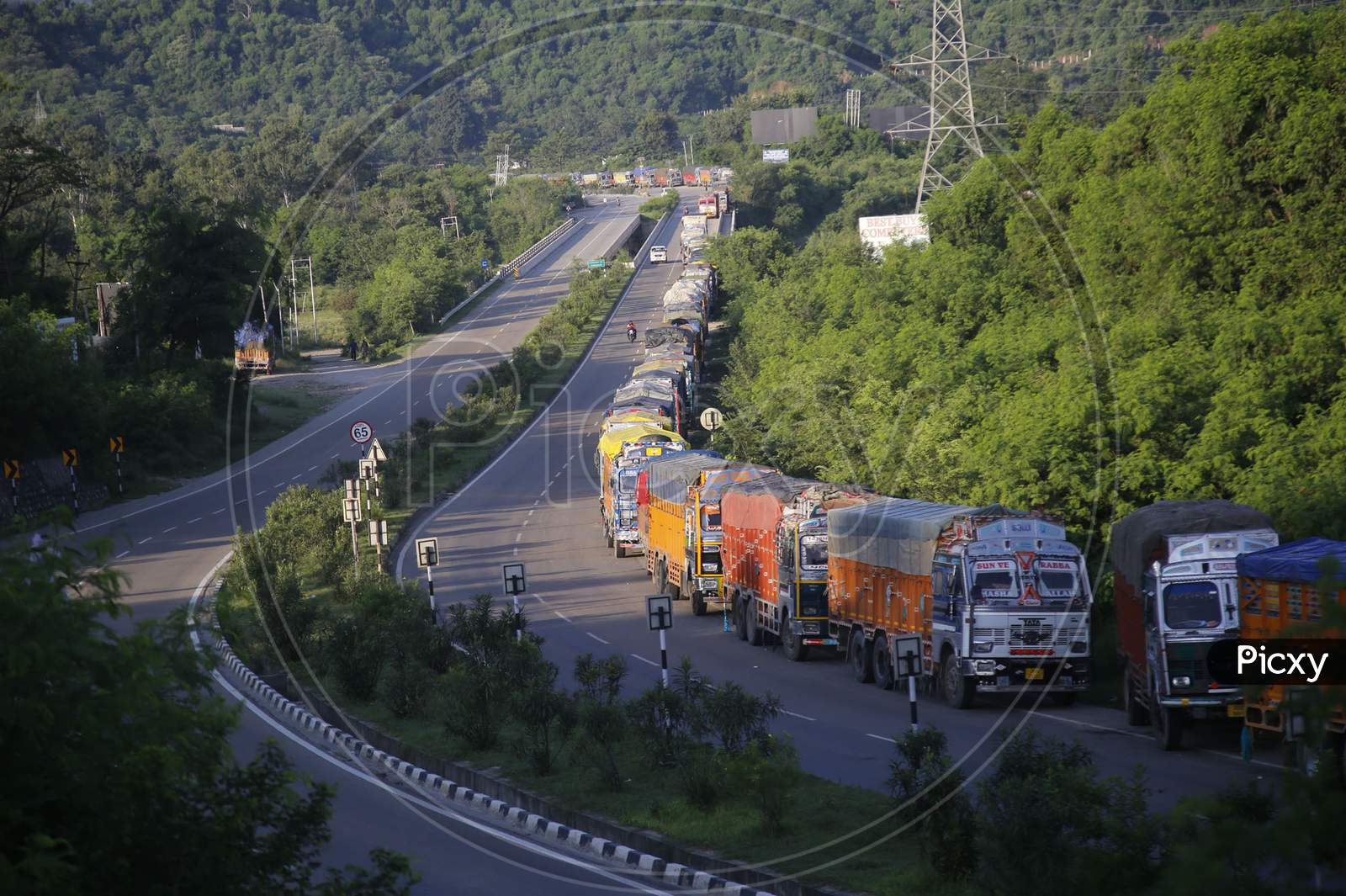 Stranded Trucks wait for the opening of the Jammu-Srinagar national highway, that was close due to landslide in Ramban area on the outskirts of Jammu on August 23,2020.