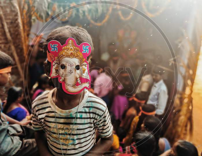 Children wearing lord Ganesha Mask
