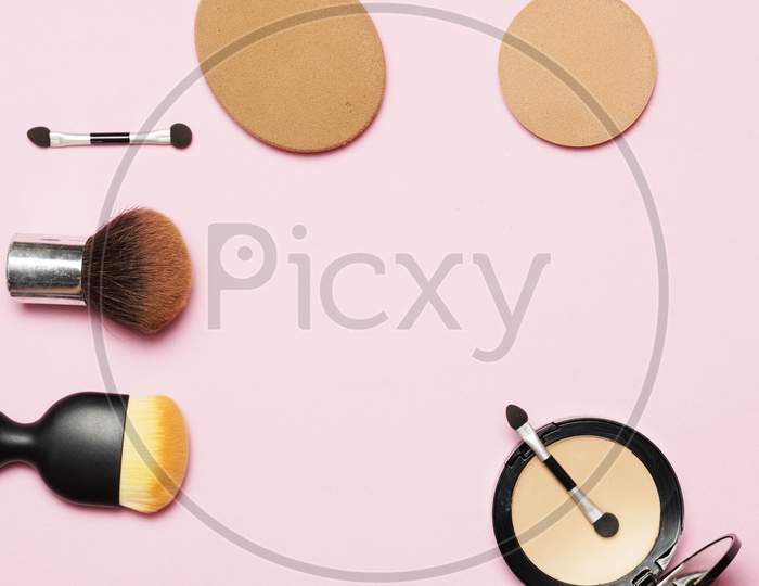 Makeup Utensils On A Pink Background. Flat Lay. Flat Design.