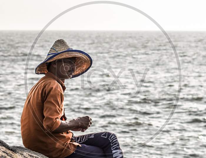 Fisherman sitting down