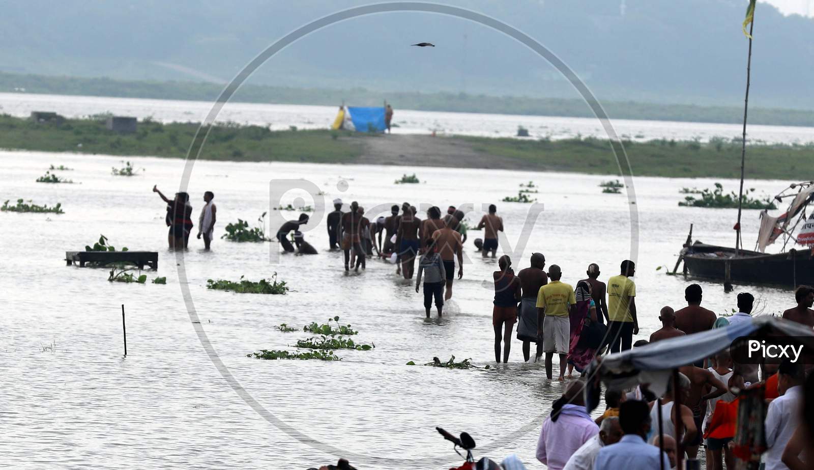 Hindu Devotees Cross The Flooded Water Of The River Ganga After Heavy Rains In Prayagraj, August 23, 2020